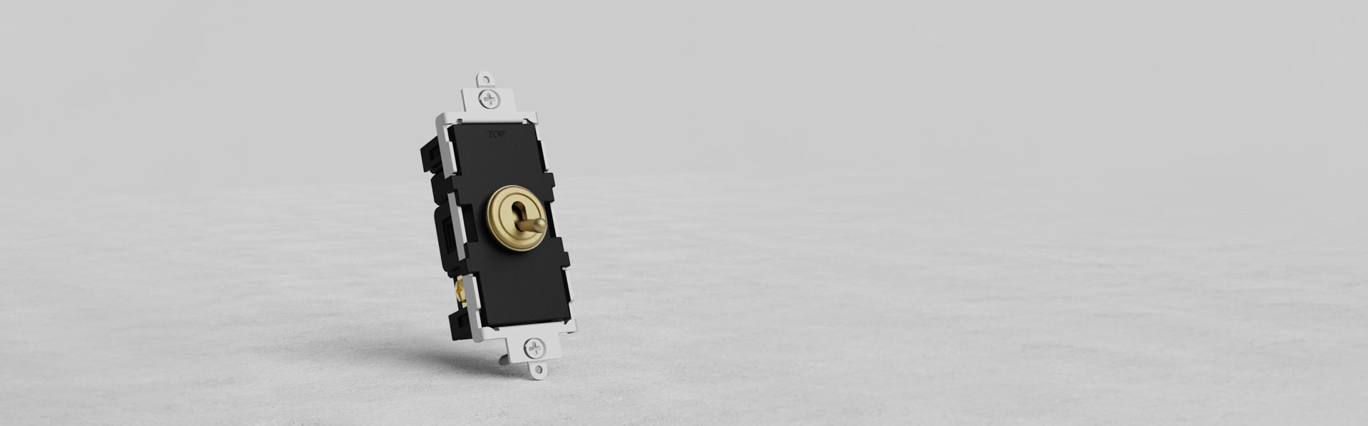 A close-up of a black electrical switch with a round toggle in the center, mounted on a white base, set against a light gray background.
