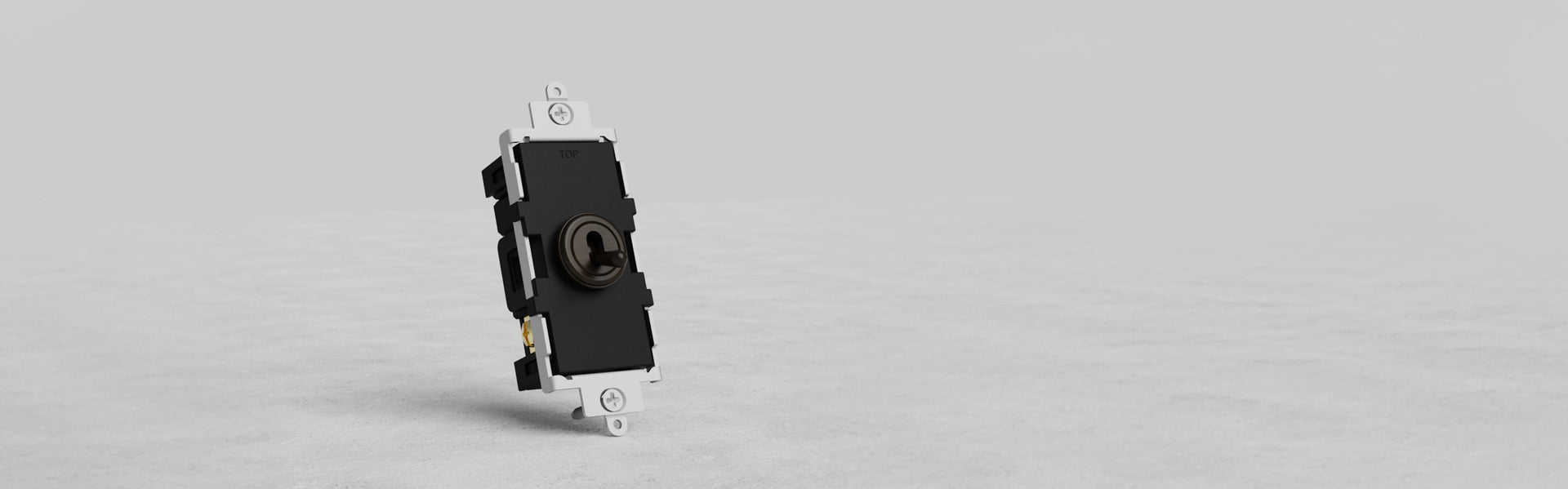 A close-up of a black electrical switch with a round toggle in the center, mounted on a white base, set against a light gray background.